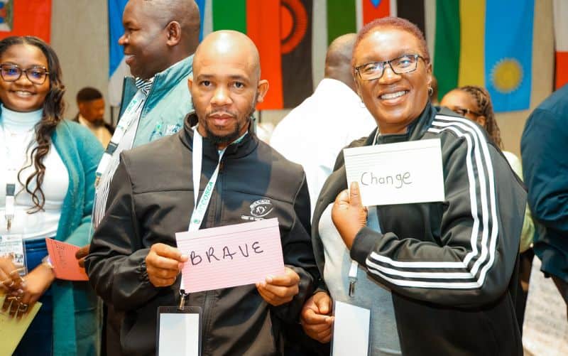 Workshop participants displaying values and leadership concepts during an activity.