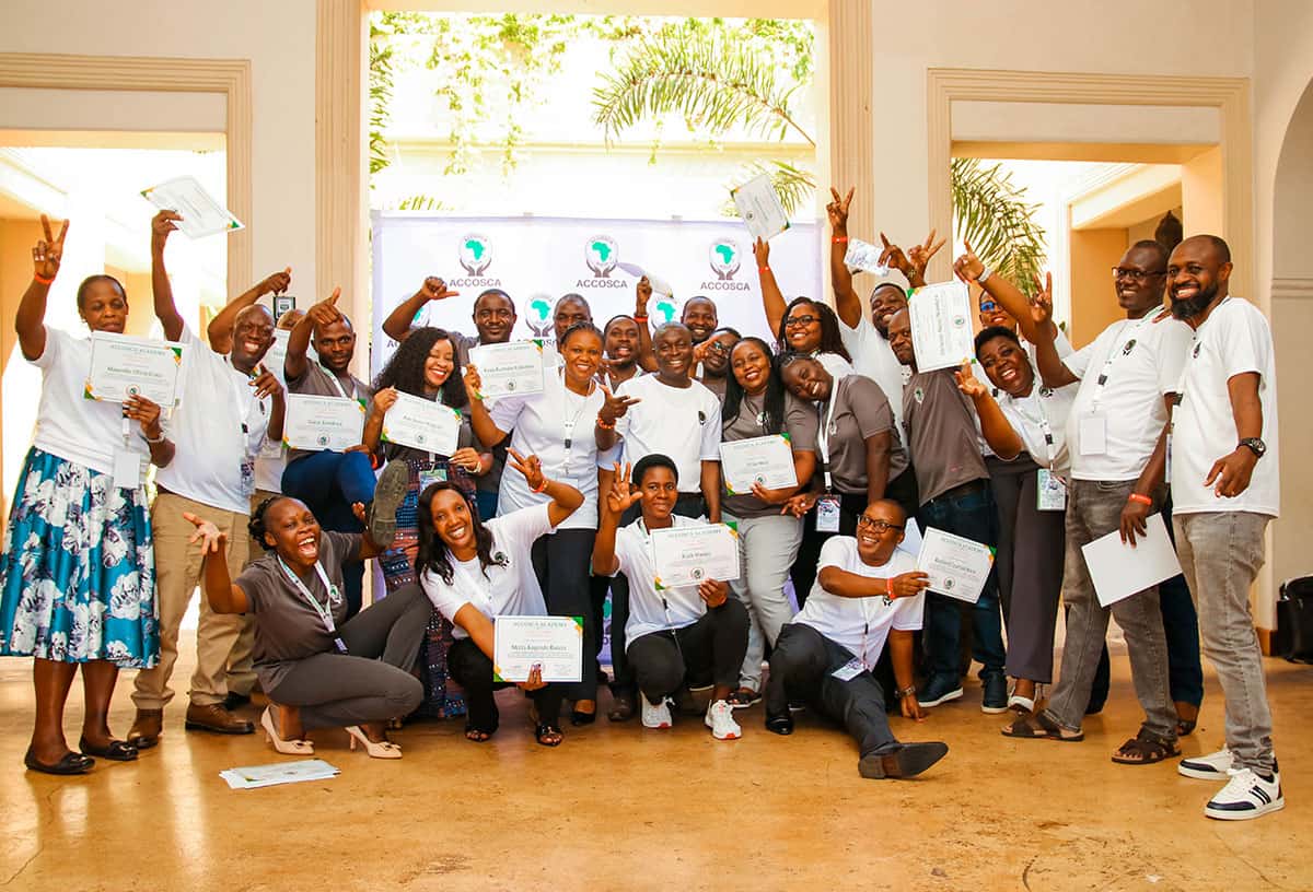 Financial Coaching Certification Graduates in a group photo.
